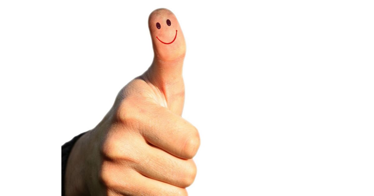 thumb with smiley drawn