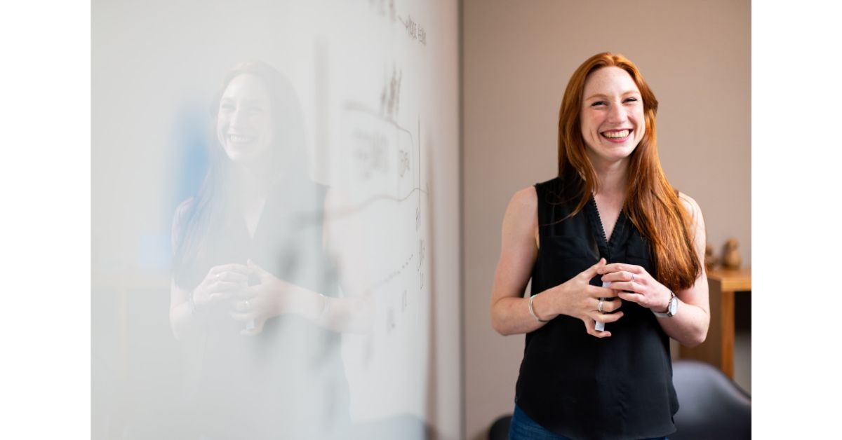 smiling teacher in black dress