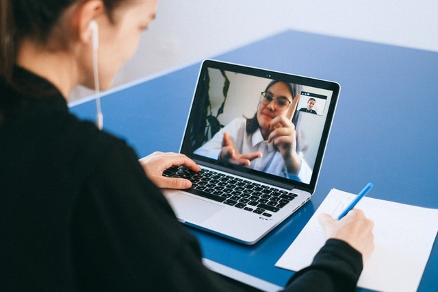 Girl talking with her friend through online