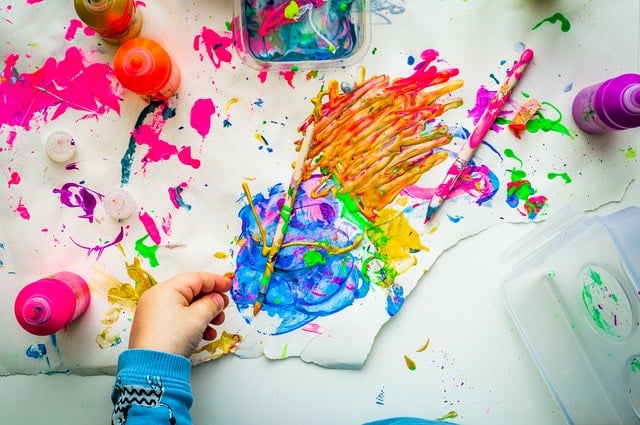 Kid's hand doing paintings