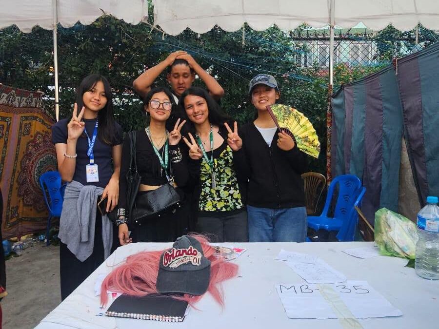 Golden Peak High School Student Council and teachers at Boudha Mahotsav 2083 face painting stall